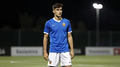 A tight waist-up shot of an anonymous 26-year-old midfielder in a blue jersey and white shorts, with a determined...